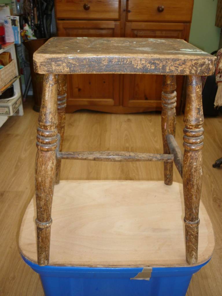Ancient and rustic farm house stool