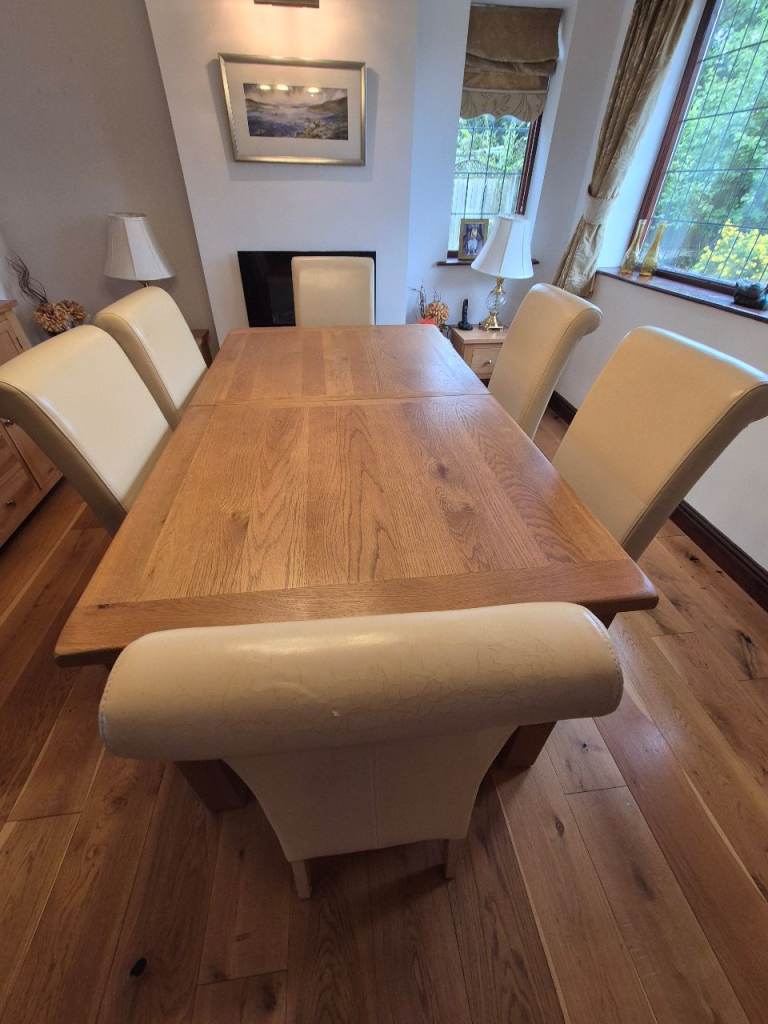 Solid oak dining table & 6 cream/oak chairs