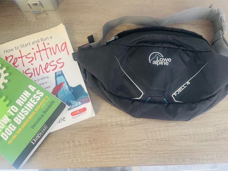 Dog walking business books and bum bag 