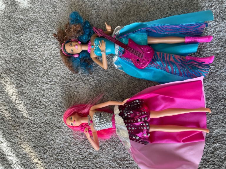 Various Barbie dolls with accessories