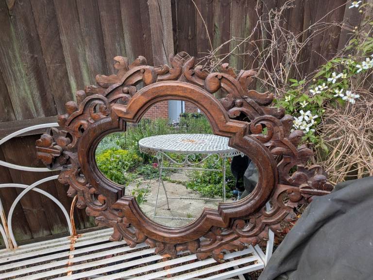 Carved wood framed mirror.