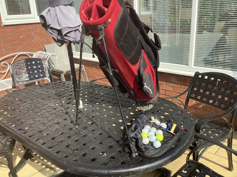 TaylorMade golf bag with rain hood plus balls £15. 