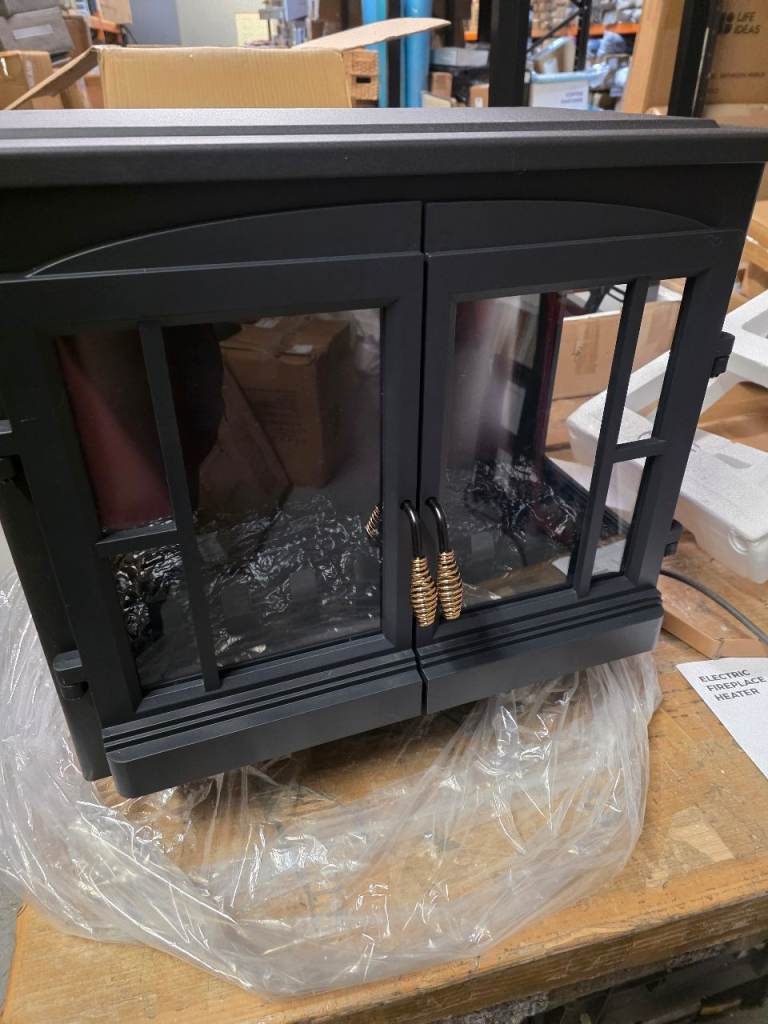 A new still boxed lovley black freestanding electric fireplace heater 