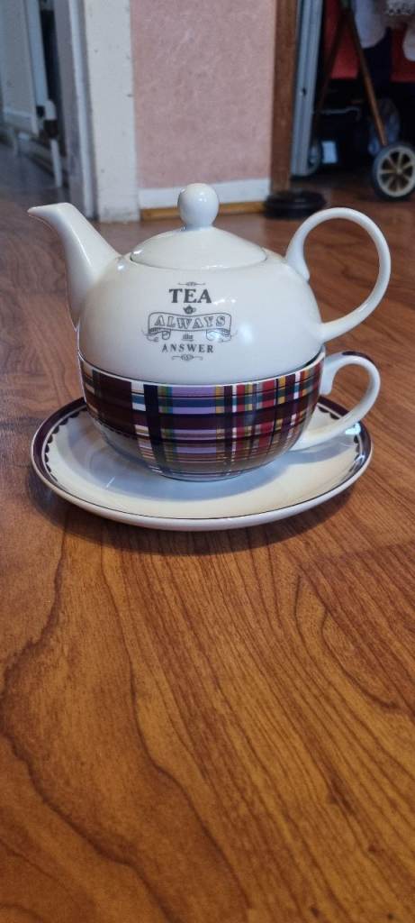 This is a Williams Sonoma Stuart Dress Tartan Individual Tea Pot with Cup and Saucer. 