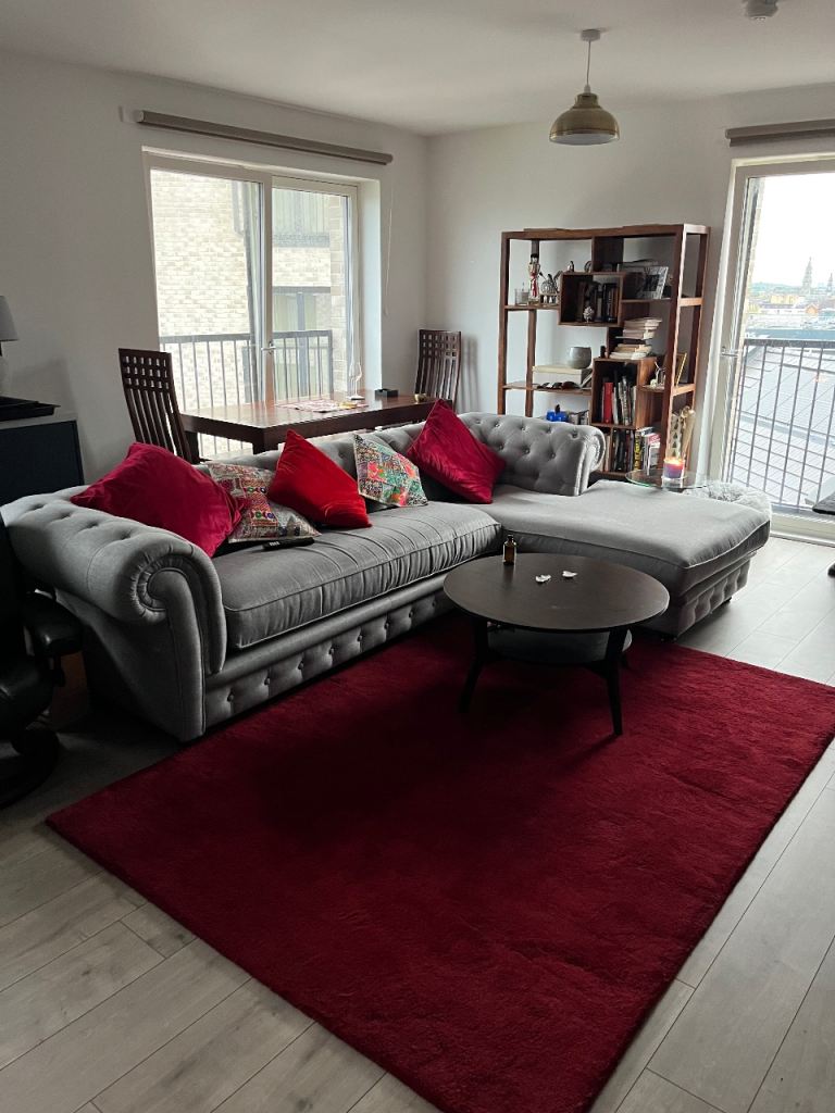 Grey chesterfield style corner sofa