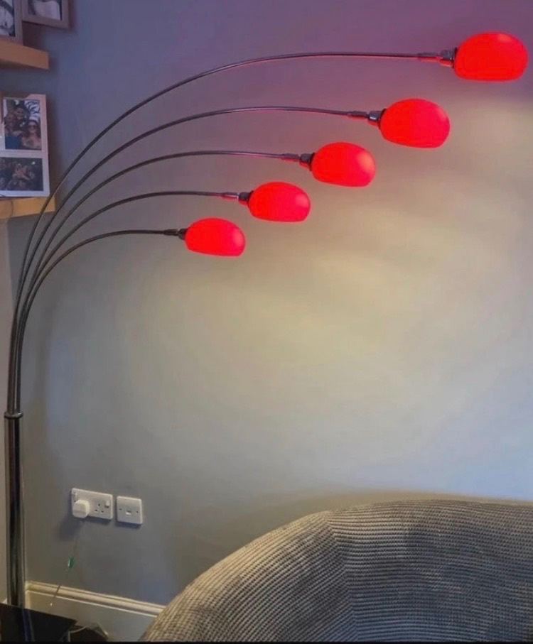 Floor lamp; 5 adjustable arms & red glass lamp shades; on marble base; on/off foot button