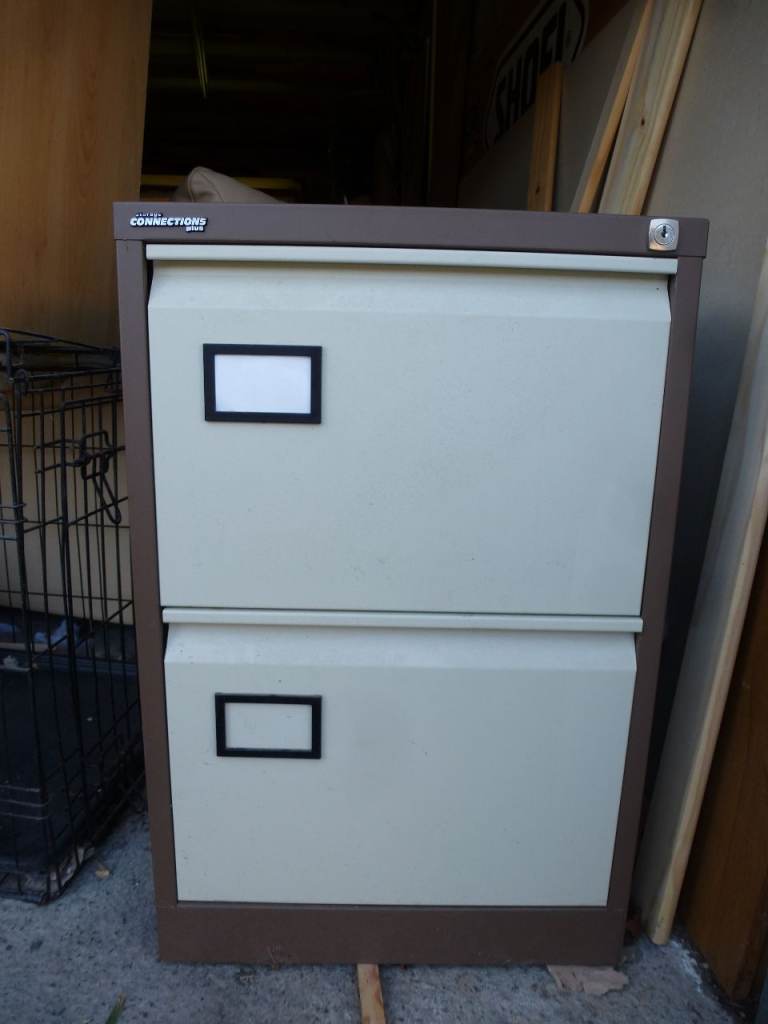 2 Drawer metal filing cabinet & files. £10.