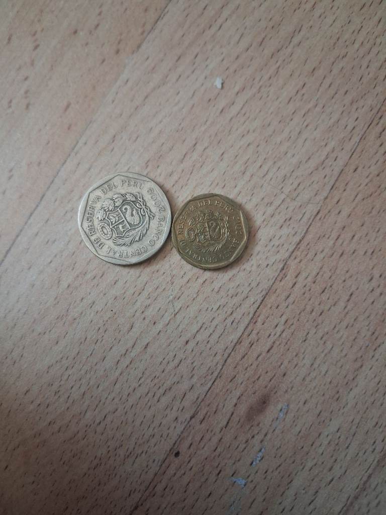 Two Foreign Coins – Peru Sol and 50 Céntimos