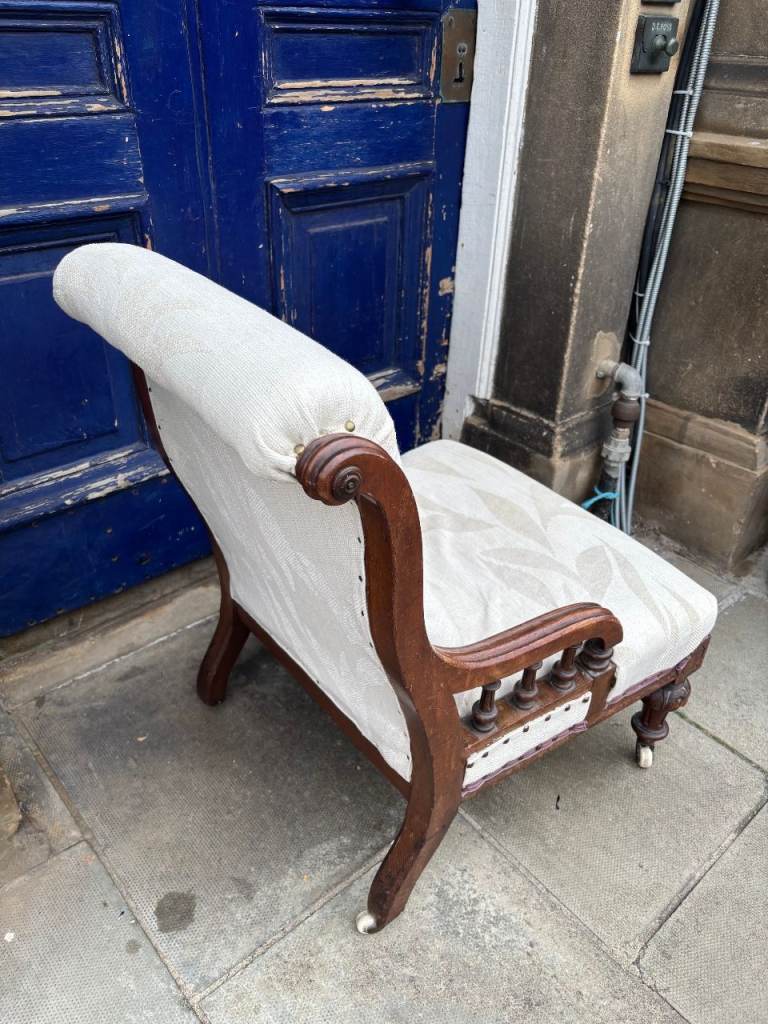 Antique low Chair , on castor wheels . Good quality and in good ...