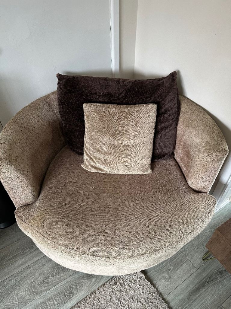Round swivel sofa with cushions