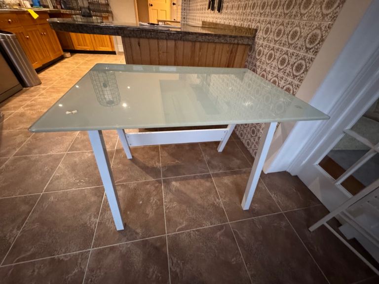 Glass topped metal utility table 