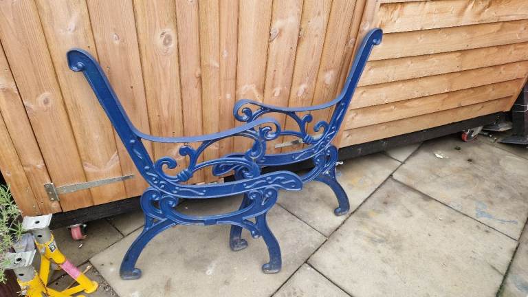Pair of ornate cast iron garden bench ends 