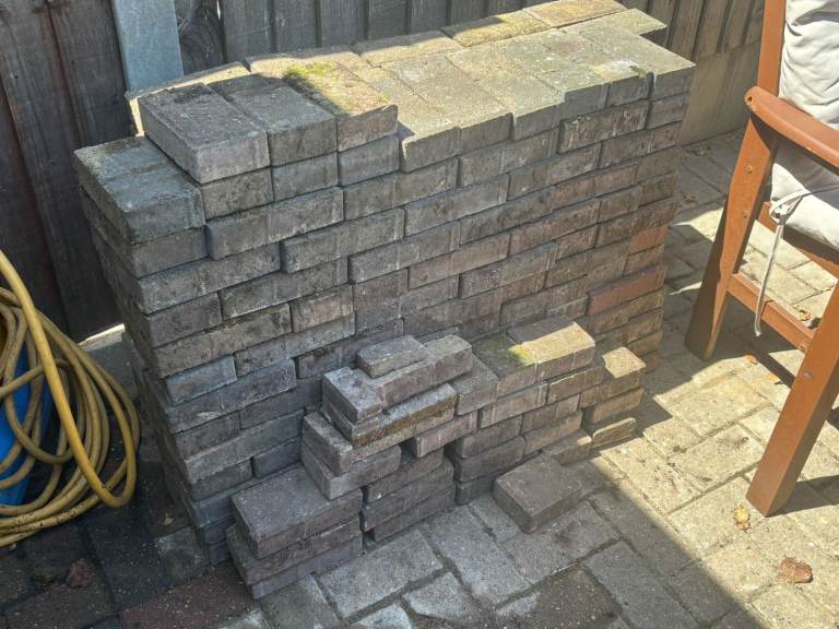 Paving Bricks (250) mainly grey bricks with some red