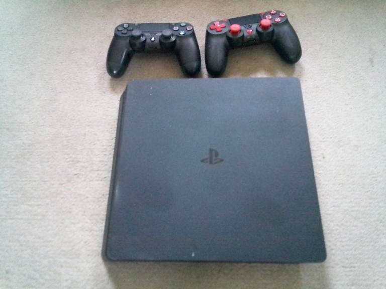 Sony PlayStation 4 Slim Console with Two Controllers plus six games 