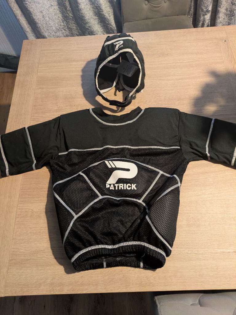 Kids rugby scrum cap and body armour shoulder pads top