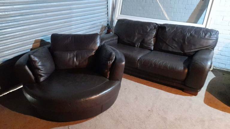 Brown leather 2 seater sofa and matching cuddle chair stylish and good condition