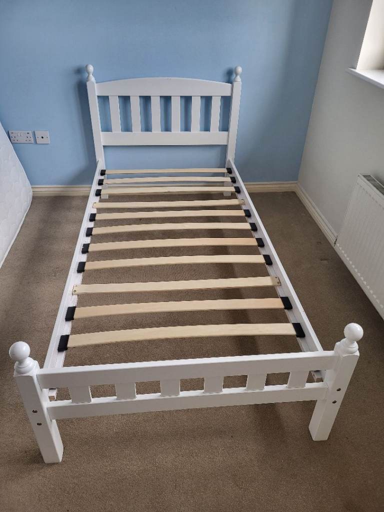 White wooden single bed