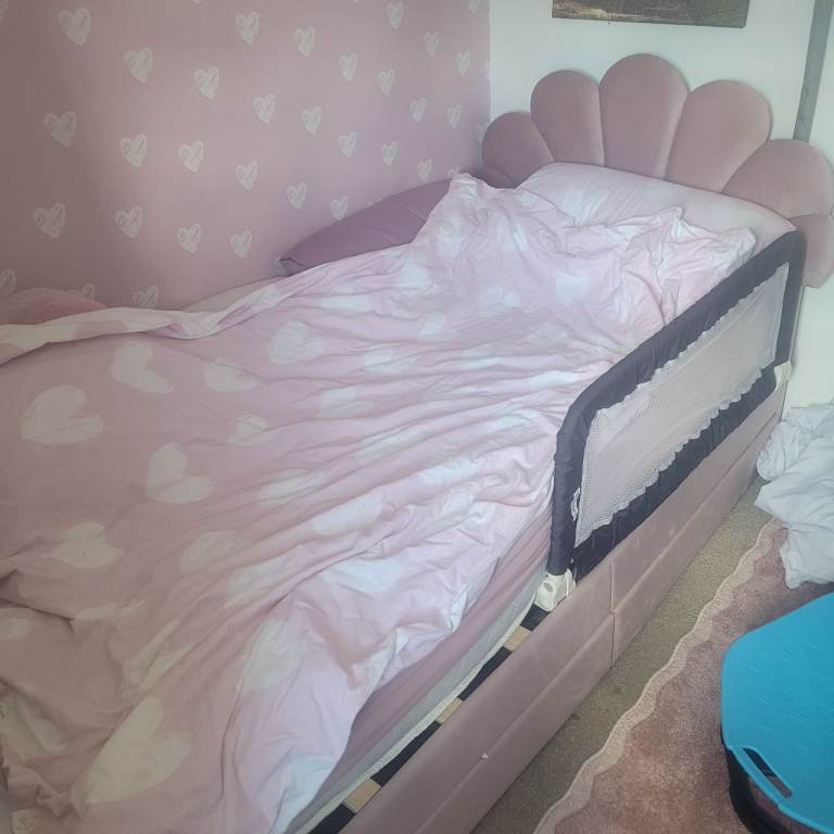 Single pink bed with mattress