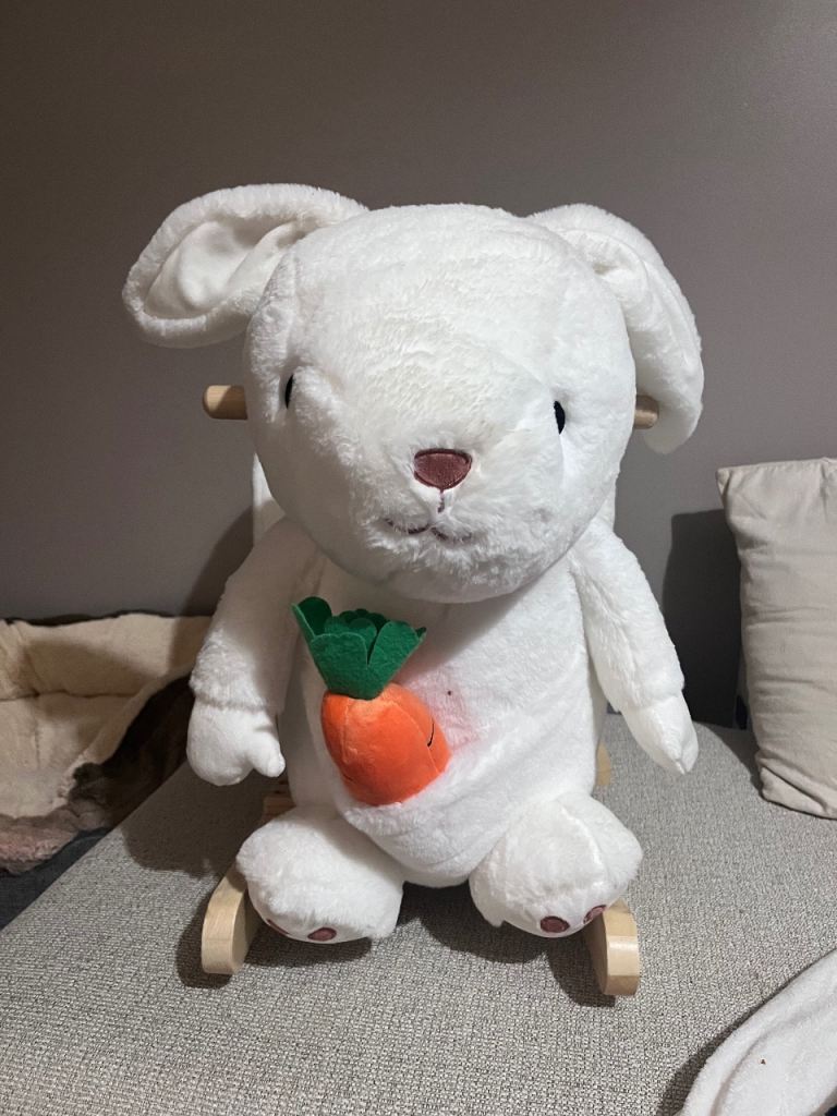 Toddlers rocking bunny. 