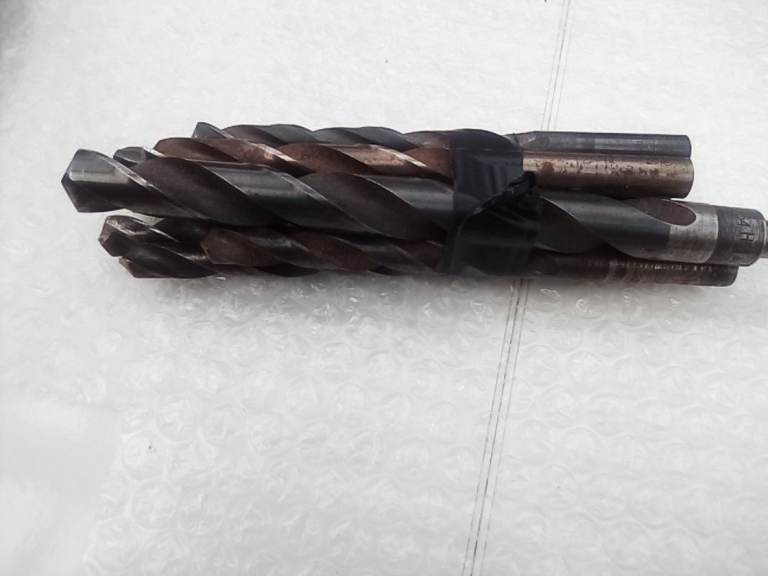 Bundle of larger size drill bits.