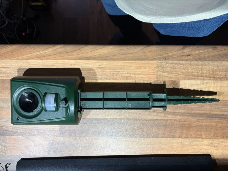 Green ultrasonic animal repeller with ground stake