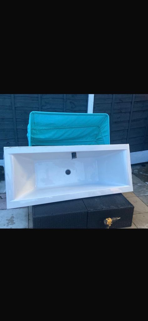 Double ended bath with tap and waste