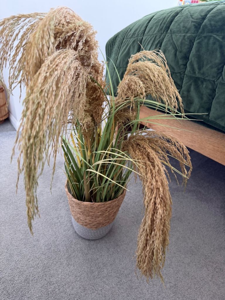 Artifical grass plant in hessian woven pot