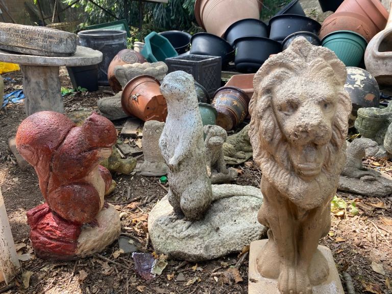Garden Ornaments - Squirrel, Otter, and Lion Stone Figures
