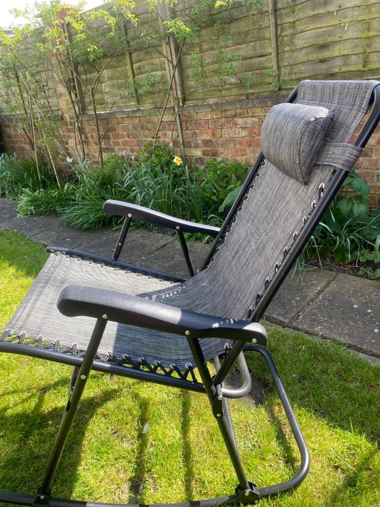 Used rocking garden chair showing slight rust
