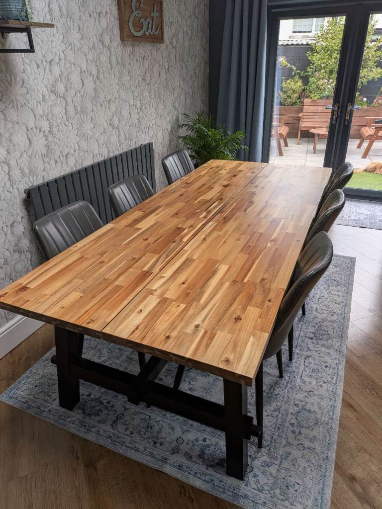 Solid Wood Dining Table with Black Legs – Good Condition