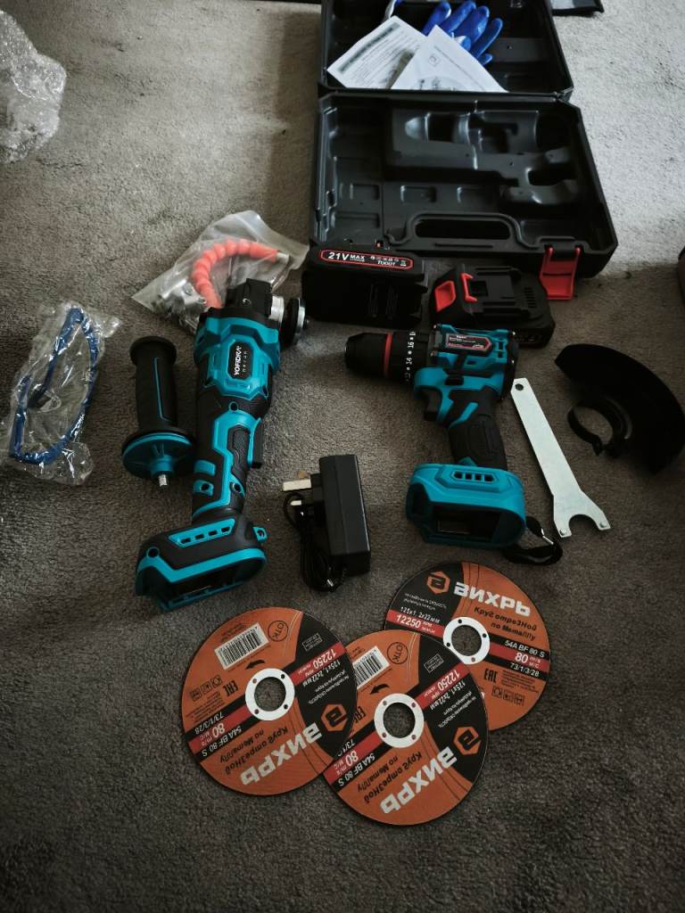 Cordless angle grinder and cordless drill with two batteries and blades 