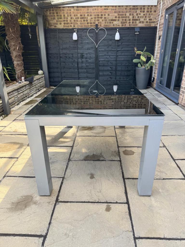 Black glass top patio table 