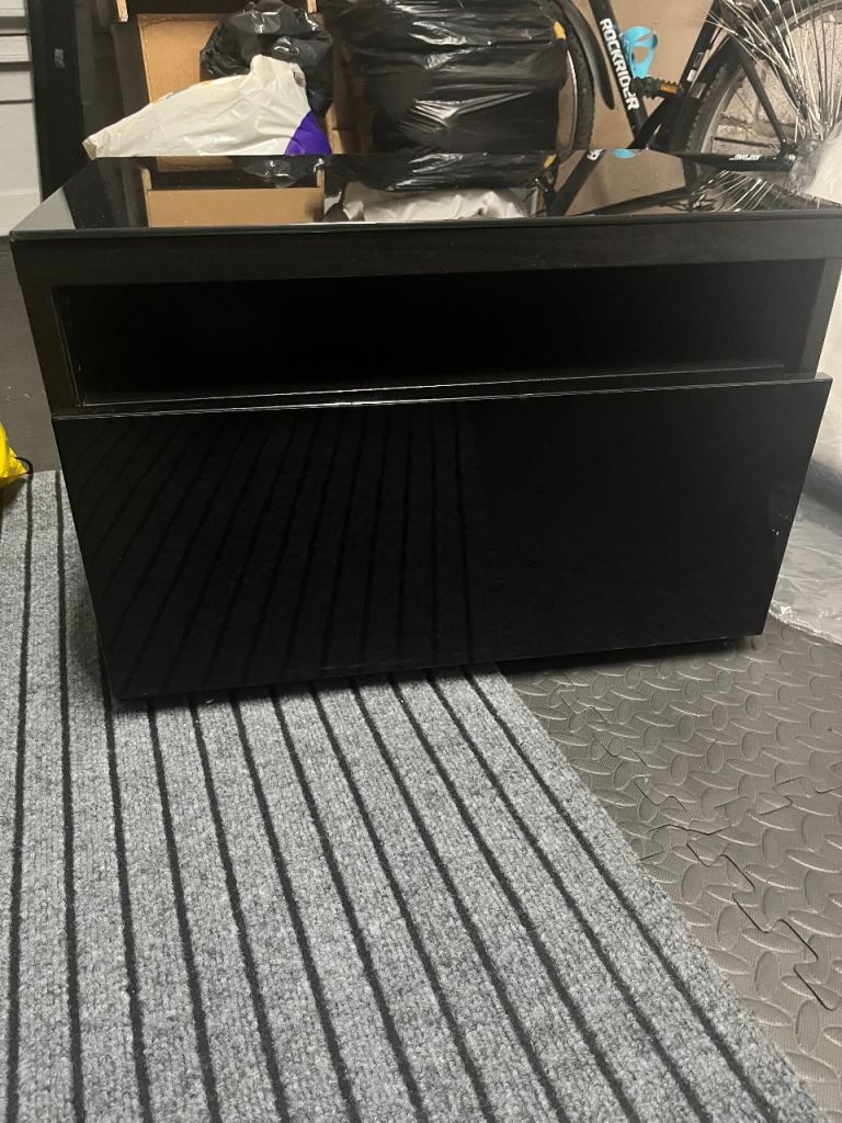 Ikea black TV unit with glass top storage drawer 