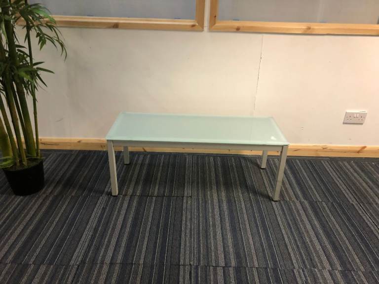 Used Blue hued glass rectangle office reception waiting breakout area coffee tables 98cm x 38cm 