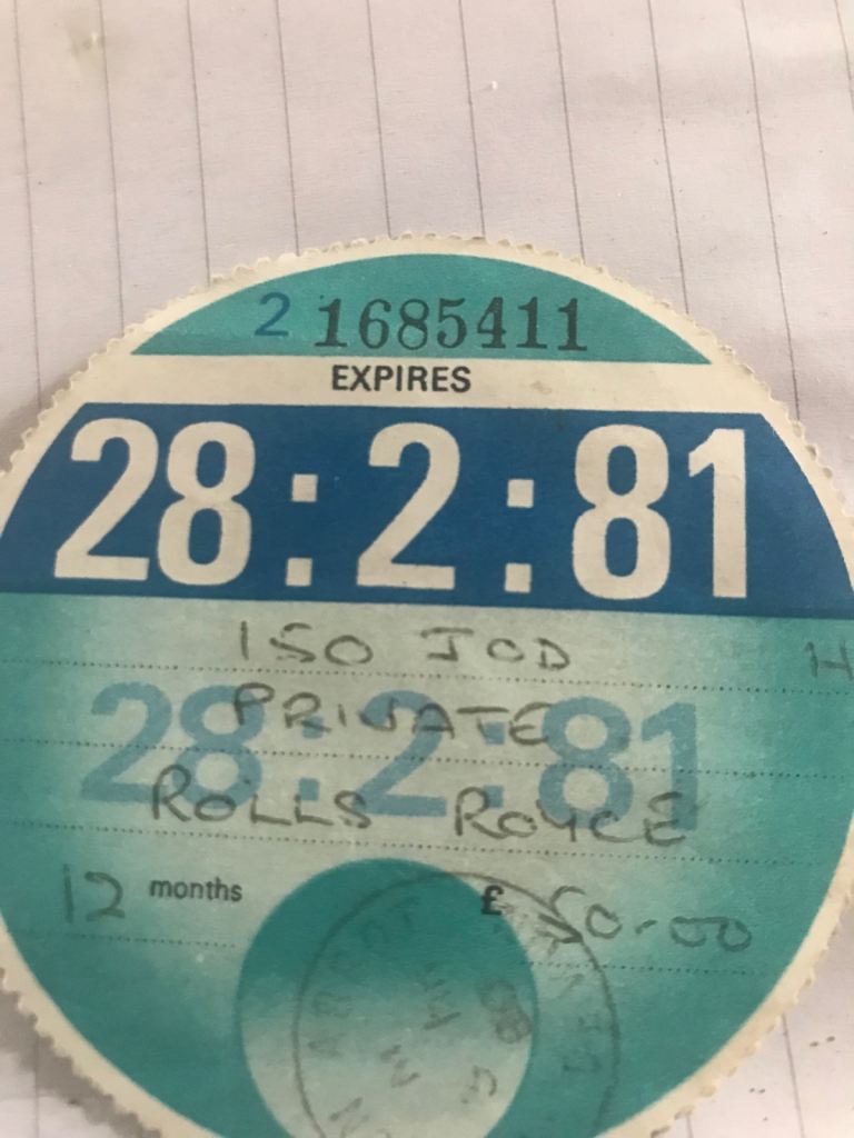 Tax disc off rolls Royce and holder