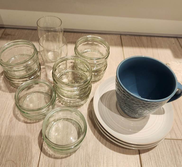 A bundle of kitchen small plates, sauce containers and wine cups 