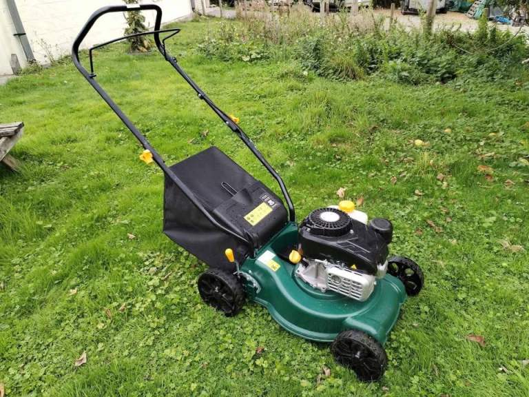 Petrol push mower like new condition costs £145 in b&q now