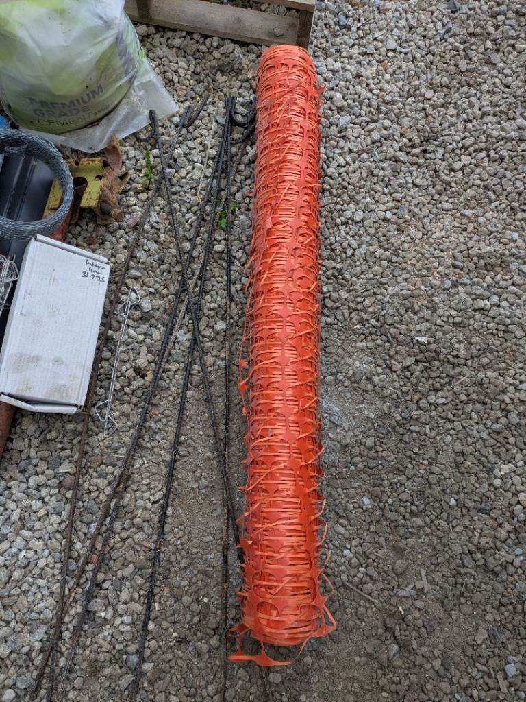 Roll of barrier mesh and pins 