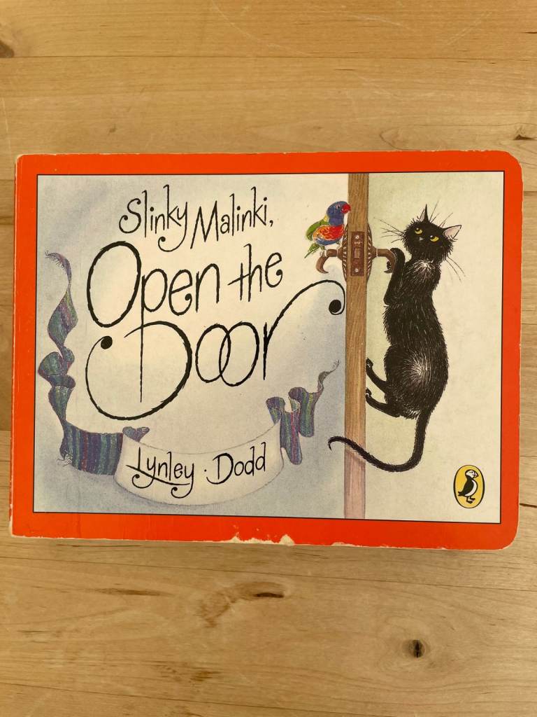 Children's book Slinky Malinki Open the Door by Lynley Dodd