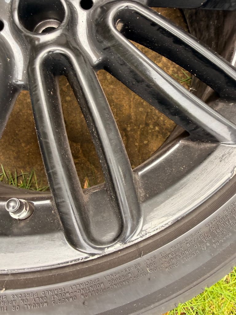 Black alloy wheels with new tyres