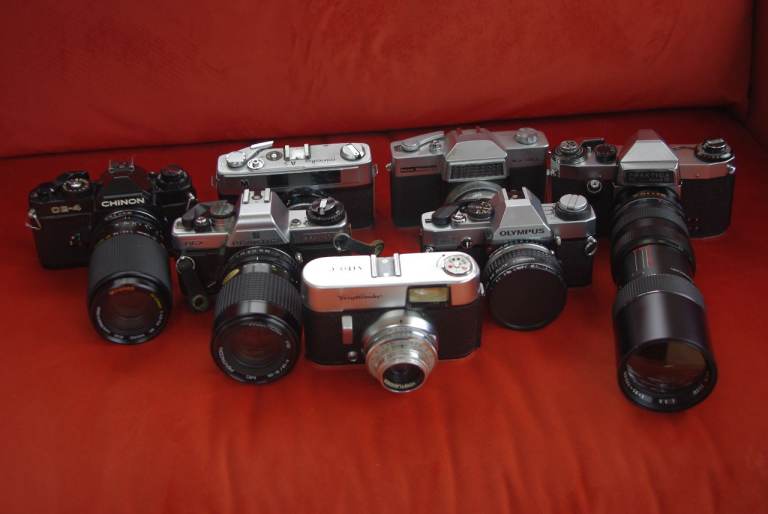 Collection of 7 Vintage 35mm Film Cameras SLR & Rangefinder with Lenses – Good Cosmetic Condition