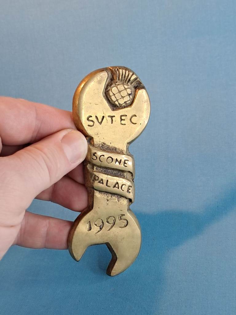 Vintage brass bottle opener similar keepsake, shaped like a wrench or spanner. 