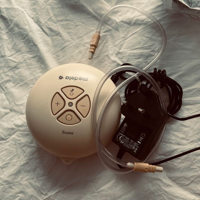 Breast pump and assorted accessories and bottles 