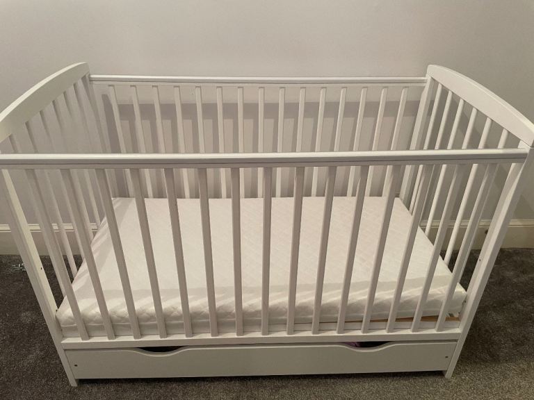 Cot with new mattress + changing table 