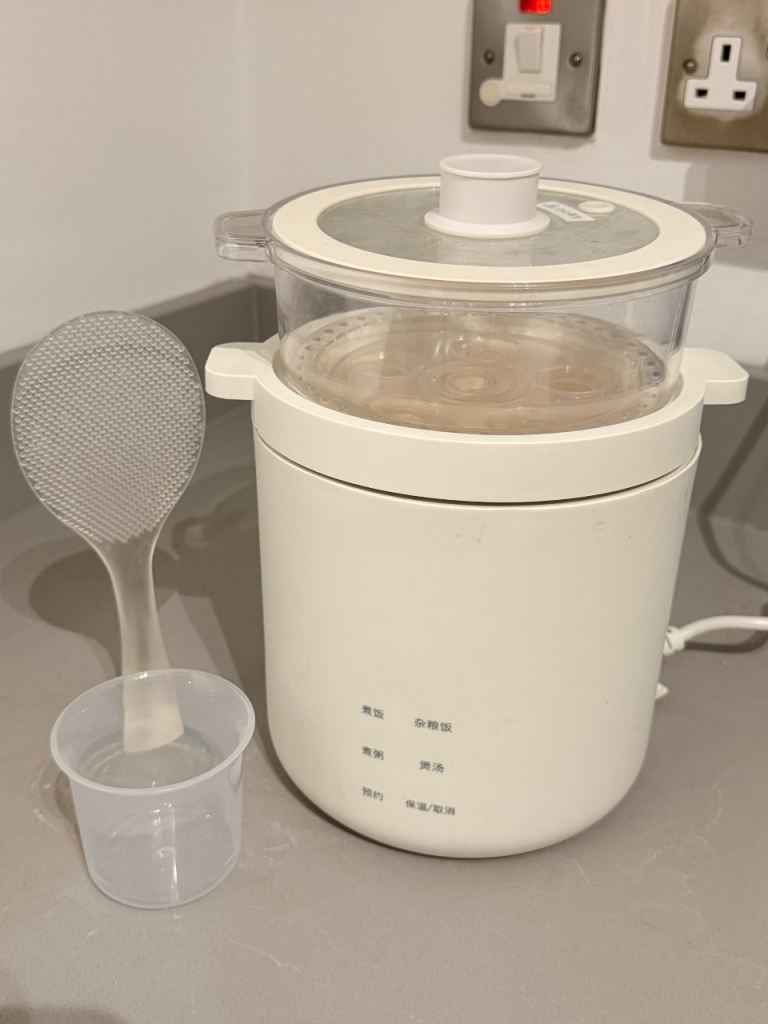 Cooking pot with steamer basket