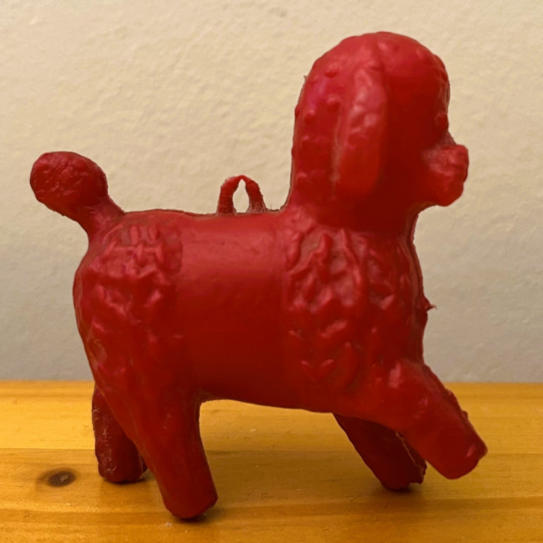 Vintage 1950/60s red lightweight hollow plastic poodle toy, hanging loop. Happy to post.