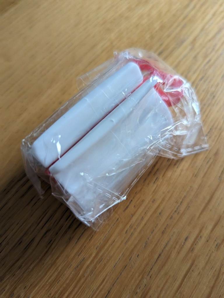 Rolling Tube Toothpaste Squeezer Holder/Stand (Red) - unwanted gift - brand new