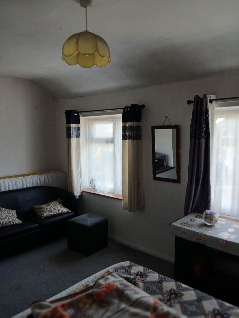 Double bed room available in a share house .