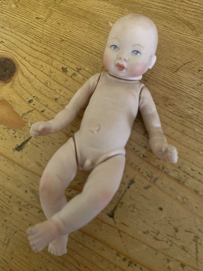 2 vintage dolls, 1 from 1985, 1 eatlier bisque doll