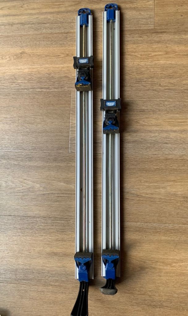 Draper guide rail and stops
